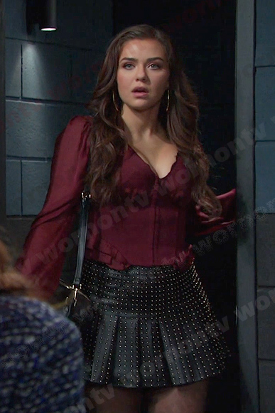 Ciara's burgundy corset top and black studded skirt on Days of our Lives