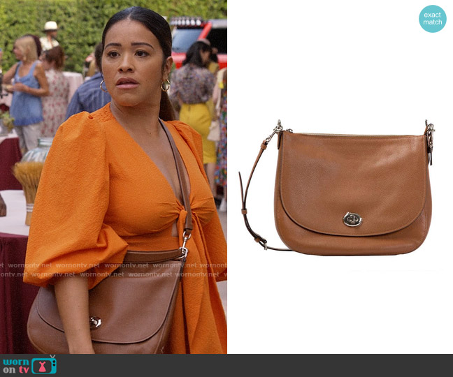 Turnlock Satchel Bag Coach worn by Nell Serrano (Gina Rodriguez) on Not Dead Yet
