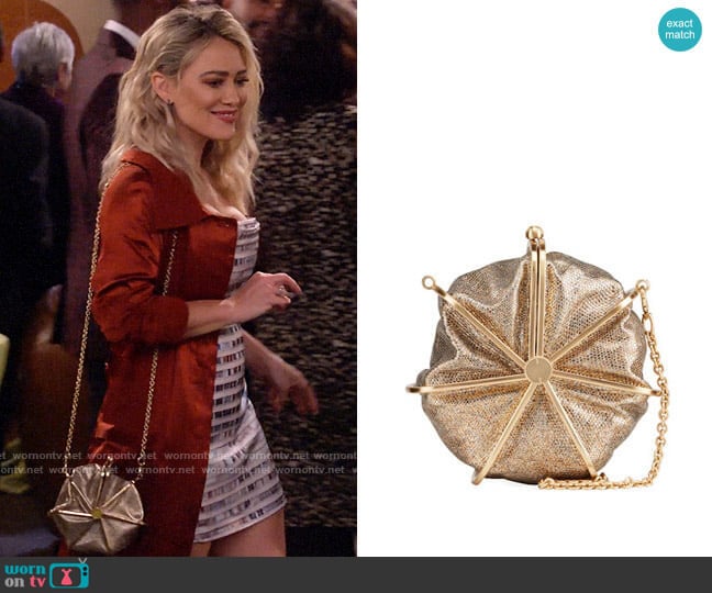 Cult Gaia Nika Metallic Textured Round Crossbody Bag worn by Sophie (Hilary Duff) on How I Met Your Father