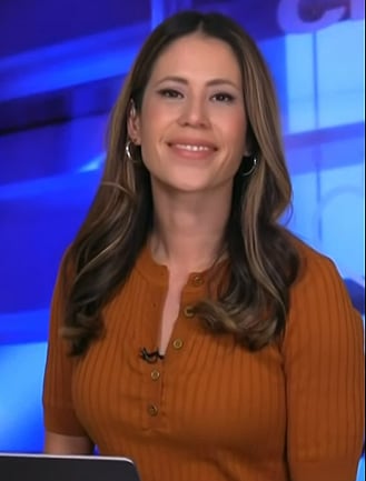 Deirdre’s orange ribbed top on NBC News Daily