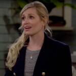 Gemma’s navy blazer with gold buttons on The Neighborhood