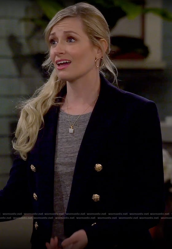 Gemma’s navy blazer with gold buttons on The Neighborhood