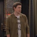 Jesse’s live music t-shirt and green wool overshirt on How I Met Your Father