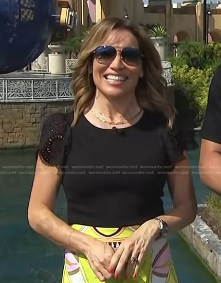 Kit’s black ruffle sleeve top and print shorts on Access Hollywood