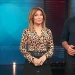 kit’s leopard print shirt and black mini skirt on Access Hollywood