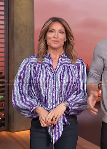 Kit’s purple floral striped blouse on Access Hollywood