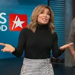 Kit’s black sweater and tweed mini skirt on Access Hollywood