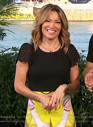 Kit’s black ruffle sleeve top and print shorts on Access Hollywood