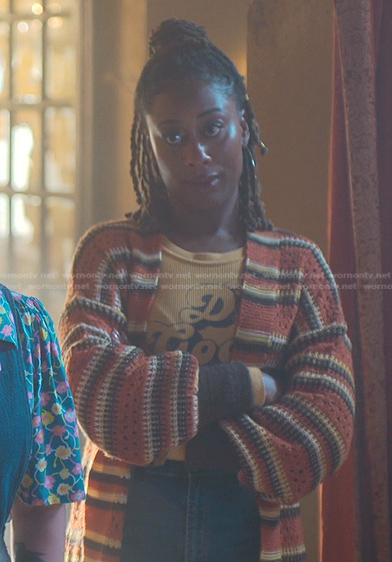 Malika's orange top and striped knitted cardigan on Good Trouble