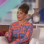 Michelle Miller’s orange geometric print dress on The Talk