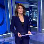 Norah’s navy pant suit on CBS Evening News