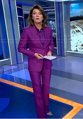 Norah’s purple tie neck blouse and suit on CBS Evening News