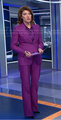 Norah’s purple tie neck blouse and suit on CBS Evening News