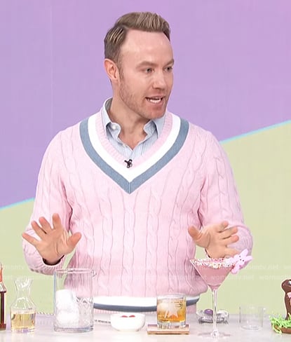 Paul Zahn’s pink varsity stripe sweater on Access Hollywood