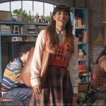 Sam’s printed sweater vest and plaid skirt on Not Dead Yet