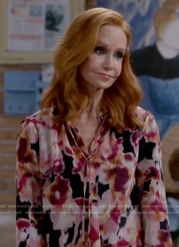 Sheila’s blurred floral blouse on Call Me Kat