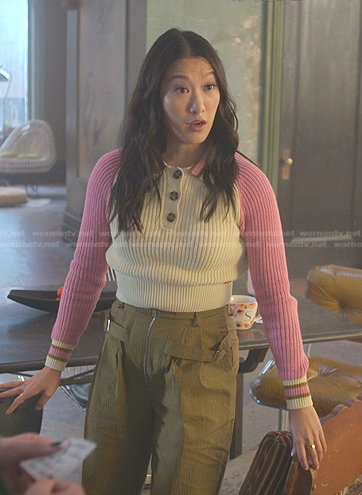 Sumi's pink colorblock polo sweater and olive green pants on Good Trouble