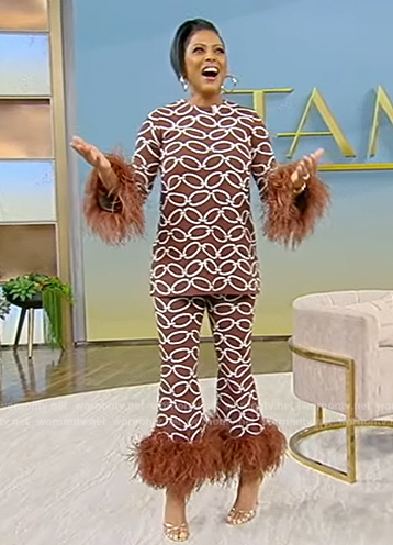 Tamron’s brown chain print feather trim top and pants on Tamron Hall Show