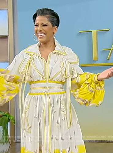 Tamron’s yellow printed blouse and skirt on Tamron Hall Show