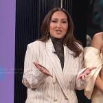 Adrienne’s white pinstripe suit on E! News