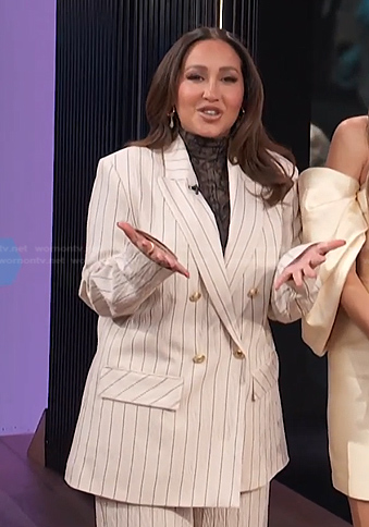 Adrienne’s white pinstripe suit on E! News