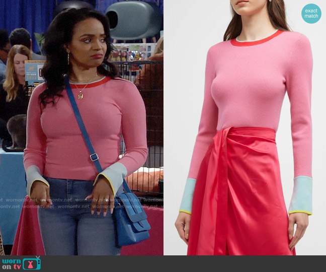 Randi’s pink knit top with blue cuffs on Call Me Kat