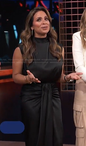 Carolina Bermudez's black satin top and skirt on E! News