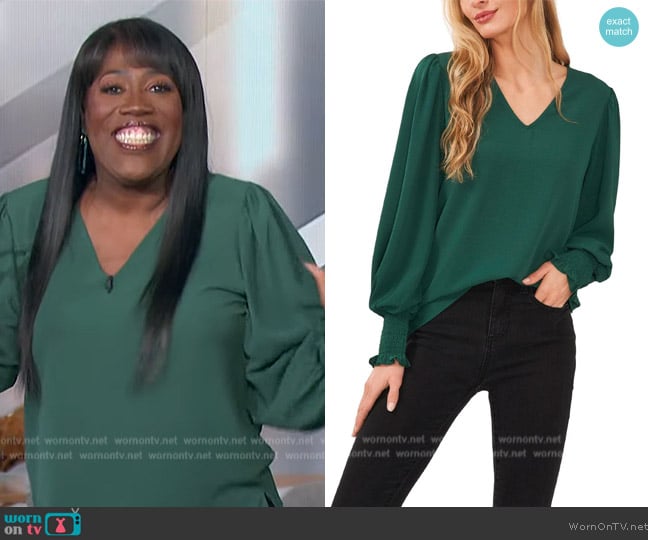 CeCe Smocked Slit Hem Pullover Top worn by Sheryl Underwood on The Talk