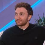 Daryl Sabara’s black face logo sweater on The Kelly Clarkson Show