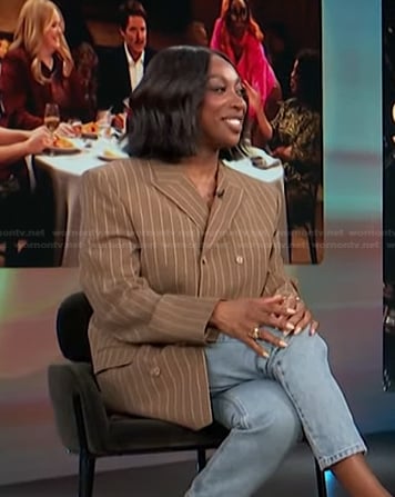 Ego Nwodim’s brown pinstripe blazer on Access Hollywood