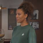 Fay’s green star print sweatshirt on Grand Crew