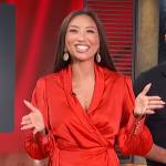 Jeannie Mai’s red satin wrap mini dress on Access Hollywood