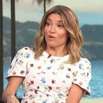 Kit’s white floral print short sleeve top on Access Hollywood