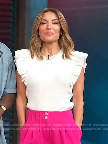 Kit’s white ruffle sleeve top on Access Hollywood