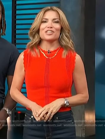 Kit’s red scalloped trim top on Access Hollywood