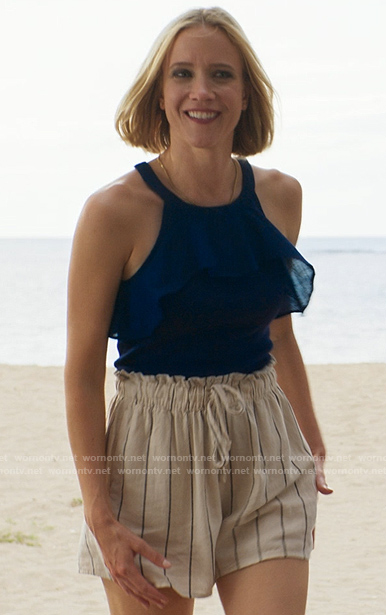 Laura's navy ruffled tank top and striped shorts on Fantasy Island