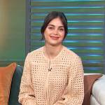 Melissa Barrera’s beige eyelet leather jacket and skirt on Access Hollywood