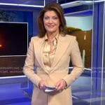 Norah's satin blouse and beige suit on CBS Evening News