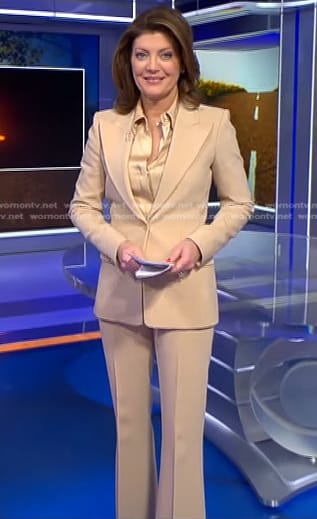 Norah’s satin blouse and beige suit on CBS Evening News