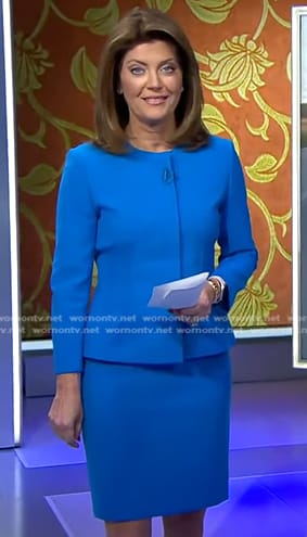 Norah's blue peplum jacket and skirt on CBS Evening News