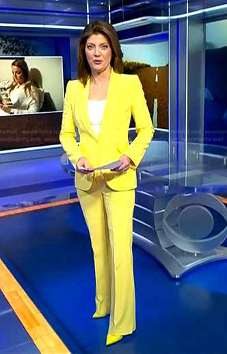 Norah’s yellow pant suit on CBS Evening News