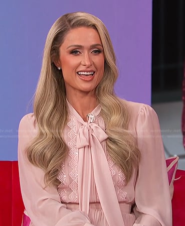 Paris Hilton’s pink tie neck dress on E! News