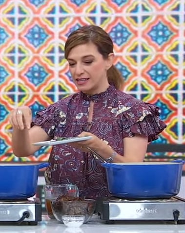 Pati Jinich’s purple printed ruffle top on Good Morning America