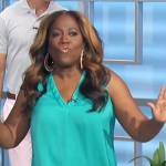 Shery’s turquoise v-neck top on The Talk