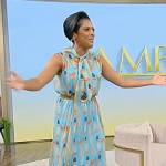 Tamron’s blue lipstick print blouse and skirt on Tamron Hall Show