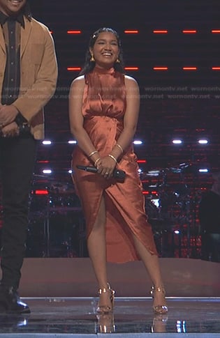 Tasha Jessen’s orange mock neck satin dress on The Voice