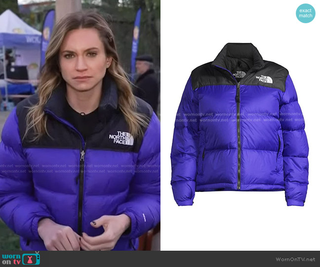 The North Face 1996 Retro Nuptse Jacket in Lapis Blue worn by Ellison Barber on NBC News Daily