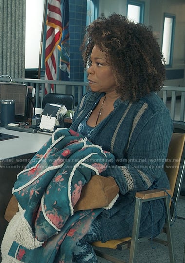 Vi's blue lace-inset shirt and floral sherpa coat on The Equalizer