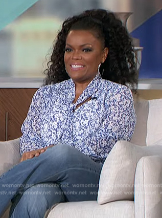 Yvette Nicole Brown's blue floral print tie neck blouse on The Talk