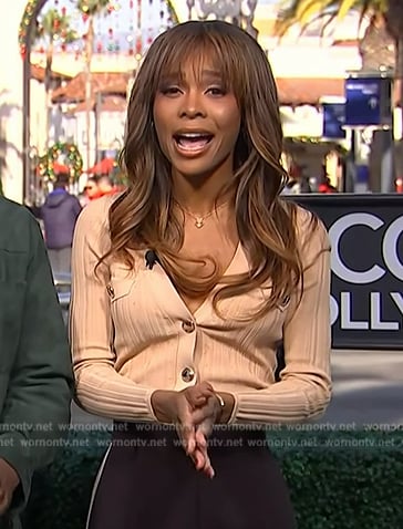 Zuri’s beige cardigan on Access Hollywood